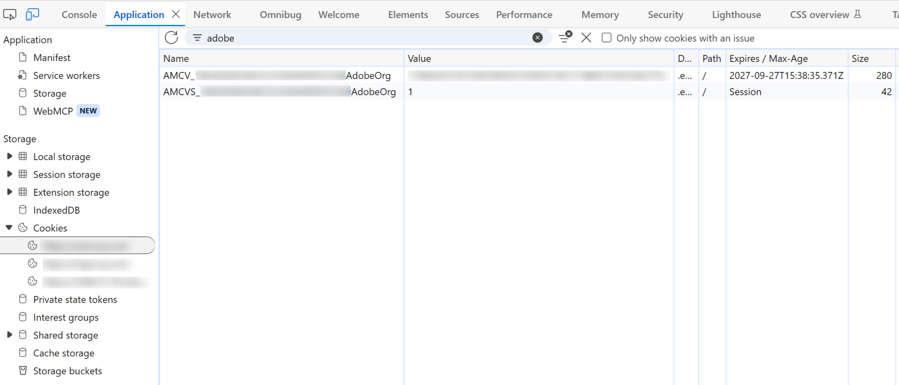 Browser developer tools open on the Application tab, with Cookies expanded in the left Storage list and three cookie domains beneath it, all blurred out. The cookie table is filtered to the word adobe and shows two rows. The first is named AMCV underscore, then a blurred organisation identifier, then AdobeOrg; its value is blurred, its path is a single slash, and its Expires column reads 2027-09-27T15:38:35.371Z with a size of 280. The second is named AMCVS underscore, the same blurred identifier, then AdobeOrg; its value is 1, its path is a slash, and its Expires column reads Session with a size of 42.